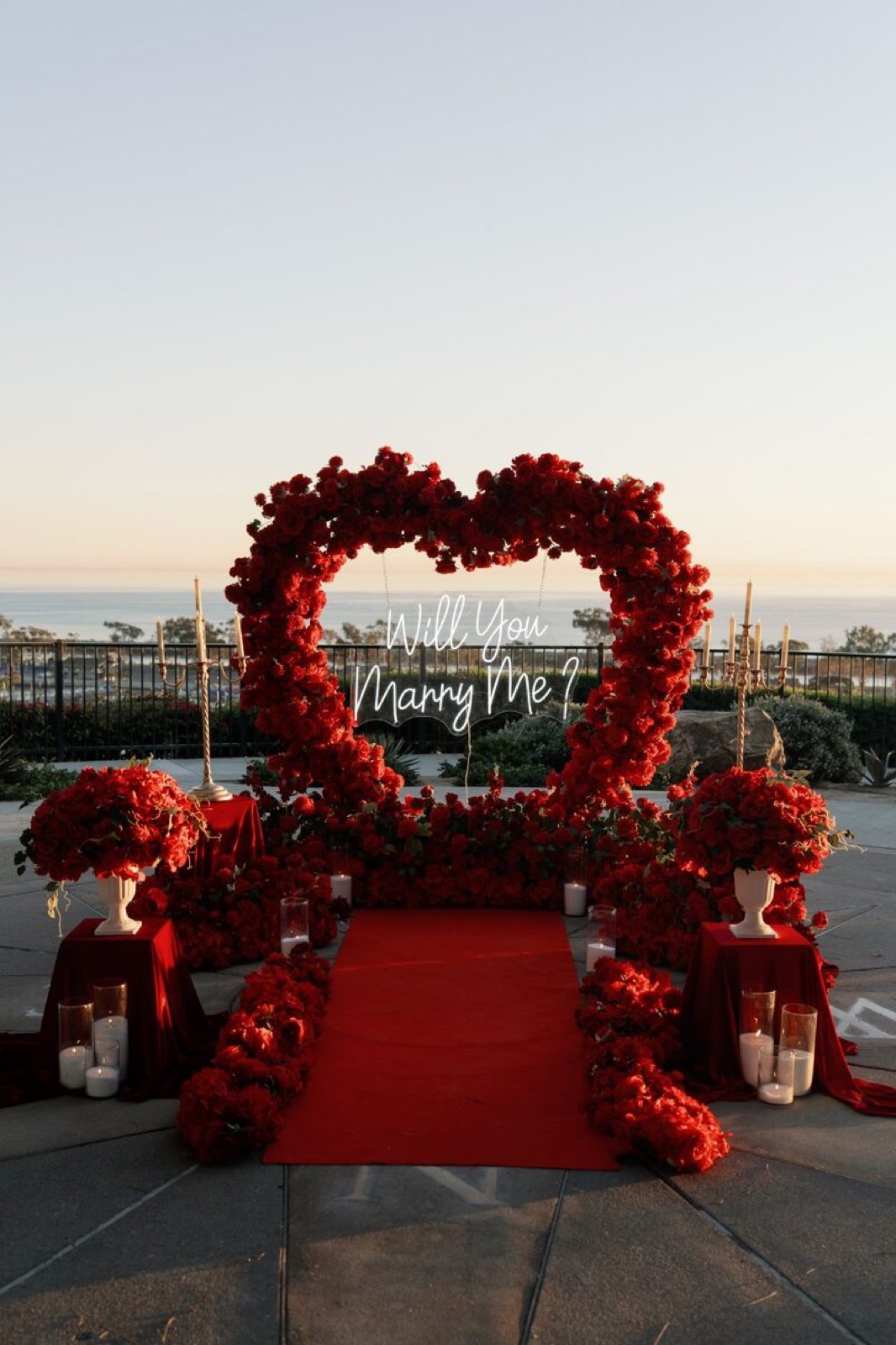 Red heart arch with neon sign